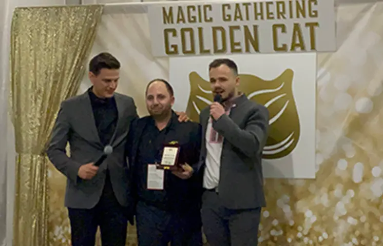 Dani Belev and Vensan giving a prize to Evgeni Tochev at Magic Gathering "Golden Cat"